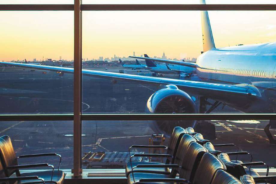 Airplane viewed through window at airport gate