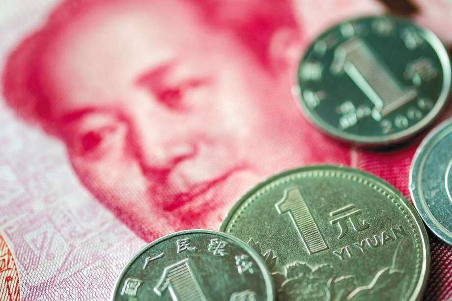 Close up of China Yuan coins and banknote for saving investment and business concept.
