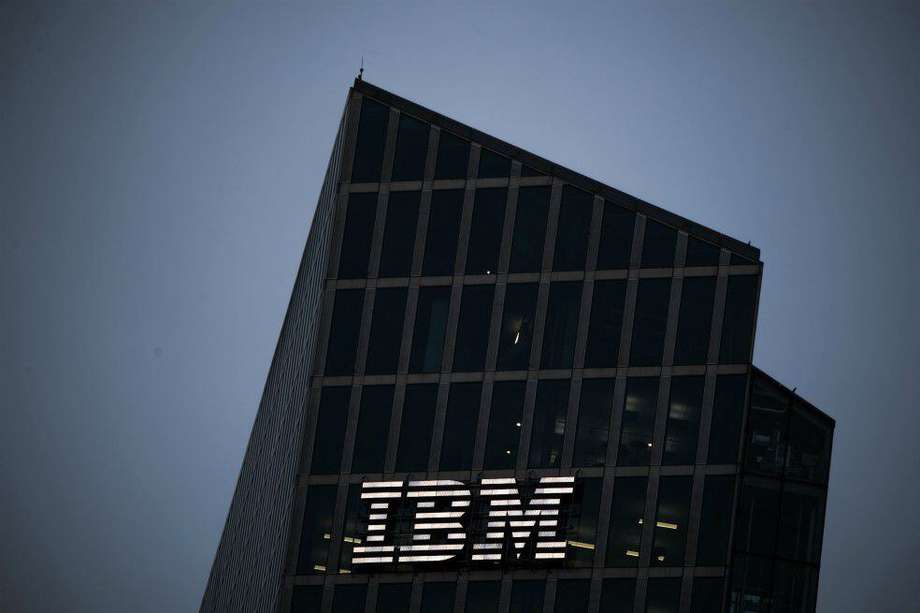 A logo sits illuminated on the International Business Machines Corp. (IBM) Watson cognitive computing platform Internet of Things (IoT) center, at the IoT center in Munich, Germany, on Thursday, Aug. 10, 2017. IBM is revamping its Global Technology Services division, which helps customers run their computer networks, to rely more heavily on artificial intelligence. Photographer: Andreas Arnold/Bloomberg