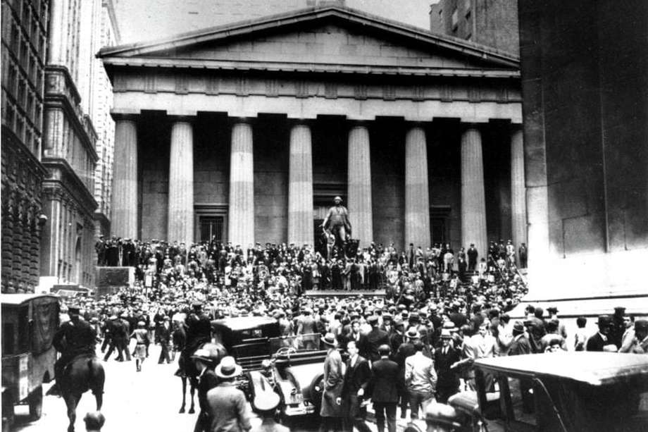 **FILE** Crowds panic in the Wall Street district of Manhattan due to the heavy trading on the stock market in New York City on Oct. 24, 1929.  (AP Photo)