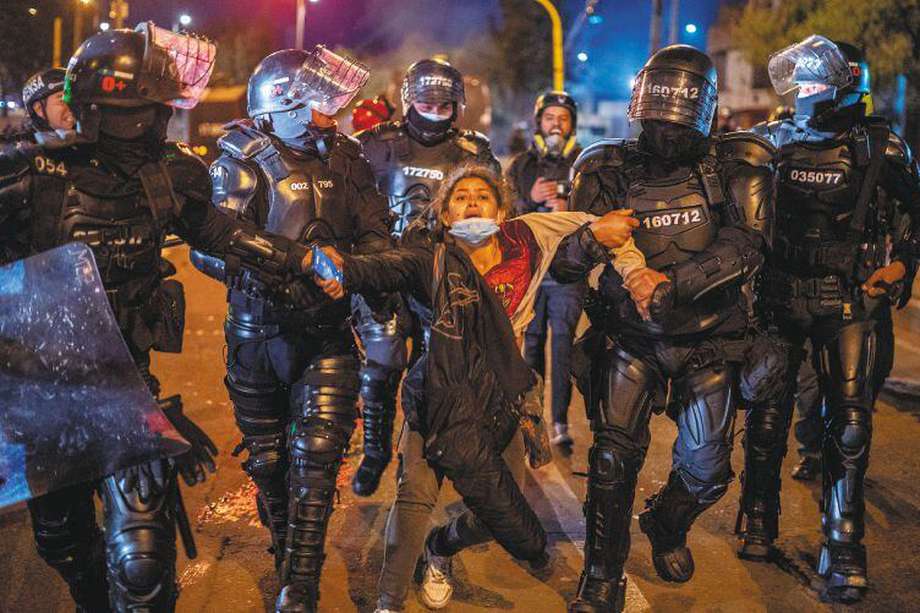 BOGOTA, COLOMBIA - MAY 25: A demonstrator is detained by Esmad agents during demonstrations against president Duque ahead of tomorrow's national strike on May 25, 2021 in Bogota, Colombia. (Photo by Diego Cuevas/Vizzor Image/Getty Images)