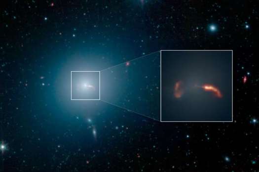 En la imagen se ve la galaxia M87 en luz infrarroja, su agujero negro central es el primero fotografiado, gracias al EHT (Event Horizon Telescope). / NASA/JPL-CALTECH/IPAC