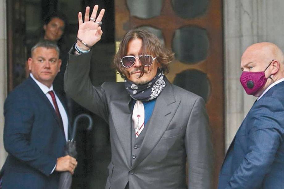 US actor Johnny Depp arrives on the second day of his libel trial against News Group Newspapers (NGN), at the High Court in London, on July 8, 2020. Depp is suing the publishers of The Sun and the author of the article for the claims that called him a "wife-beater" in April 2018. / AFP / ISABEL INFANTES
