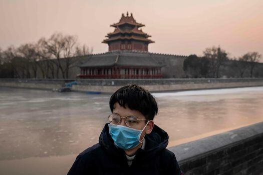 Varias ciudades chinas han obligado a sus habitantes a portar tapabocas. / AFP