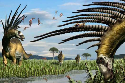 Un grupo de bajadasaurios a la vera de un curso de agua, en una vasta pradera de equisetos.  / Ilustración del paleoartista Jorge A. González. / Agencia Sinc