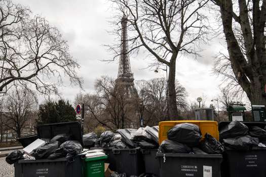Garbage bags piled up near the Eiffel Tower. 