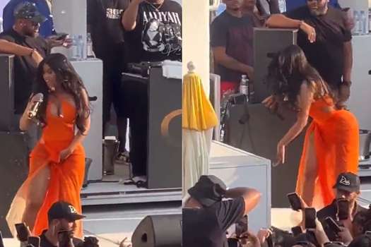 La rapera y cantante Cardi B lanza su micrófono durante una presentación en Las Vegas. 