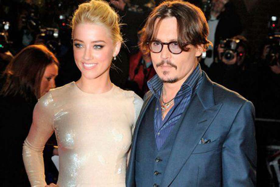 Amber Heard y Johnny Depp durante la promoción de "The Rum Diary". / Agencias