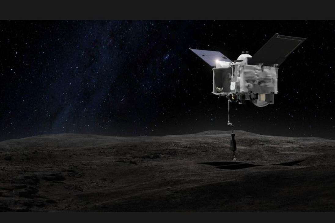 Esta es una de las simulaciones que han realizado los expertos de cómo esperan que se vea la nave espacial cuando se ponga en Bennu y con su brazo robótico tomé muestras del asteroide.