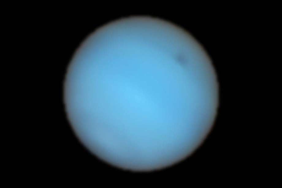 Vista de Neptuno tomada por el instrumento MUSE. En la parte superior se observa la mancha.
