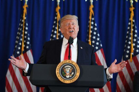 Donald Trump dice que continuará con sus medidas migratorias.  / AFP