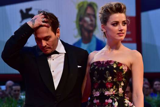 Amber Heard y Johnny Depp. / AFP
