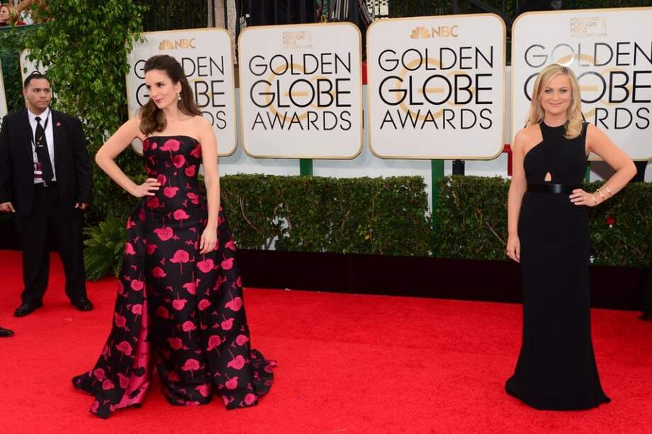 Tina Fey y Amy Poehler en los Globo de Oro 2014. / Archivo AFP