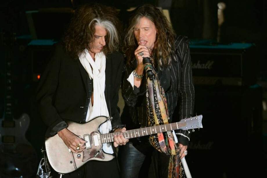 Los músicos Joe Perry y Steven Tyler.