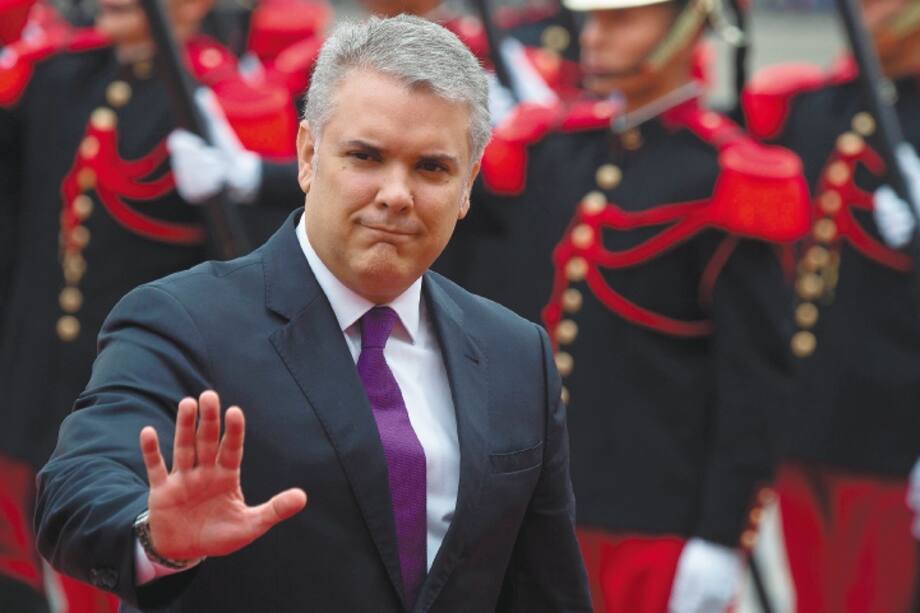 Colombia?s President Ivan Duque waves as he arrives at the presidential palace in Lima to meet with his Peruvian counterpart Martin Vizcarra on May 27, 2019.
Duque is in Peru on a one-day official visit. / AFP / Cris BOURONCLE