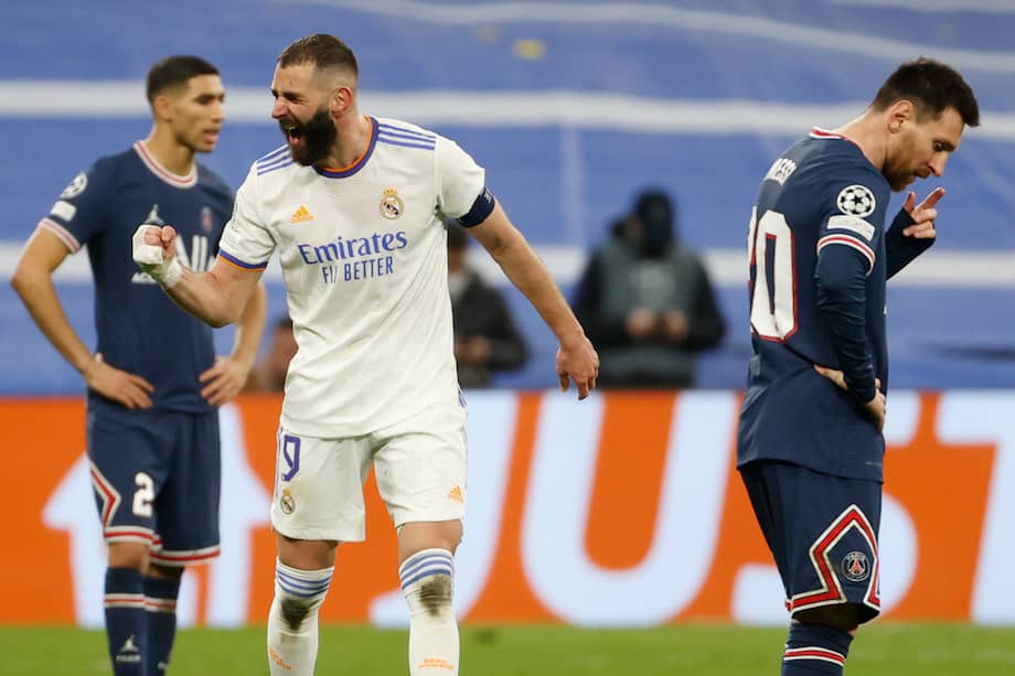 El delantero del Real Madrid Karim Benzema (c) celebra tras marcar el tercer gol ante el París Saint Germain.