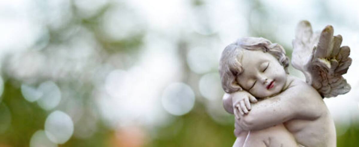 Angel guardian sleeping on the grave