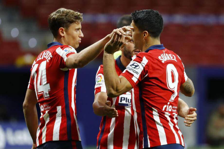 Luis Suárez (dere.) anotó el segundo tanto del cuadro colchonero.