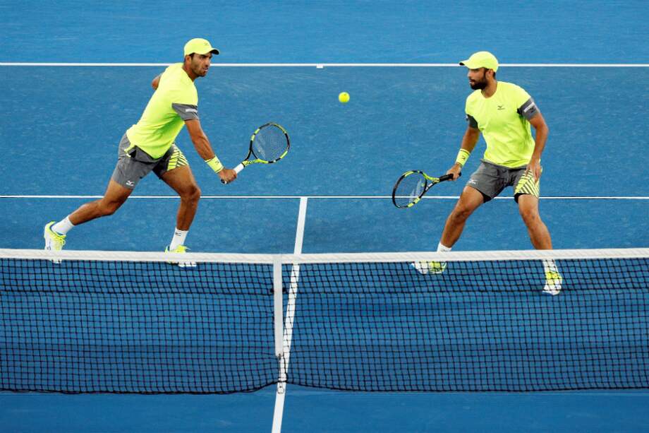 Juan Sebastián Cabal y Robert Farah, en la caja mágica de Madrid. / AFP