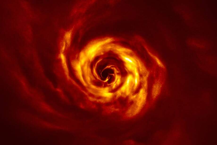 Cerca del centro de la imagen, obtenida con luz polarizada con el instrumento SPHERE del VLT, se observa el ‘giro" (en amarillo muy brillante) que marca el lugar donde se puede estar formando un planeta. Este giro se encuentra aproximadamente a la misma distancia de la estrella que Neptuno del Sol. / ESO/ Boccaletti et al.