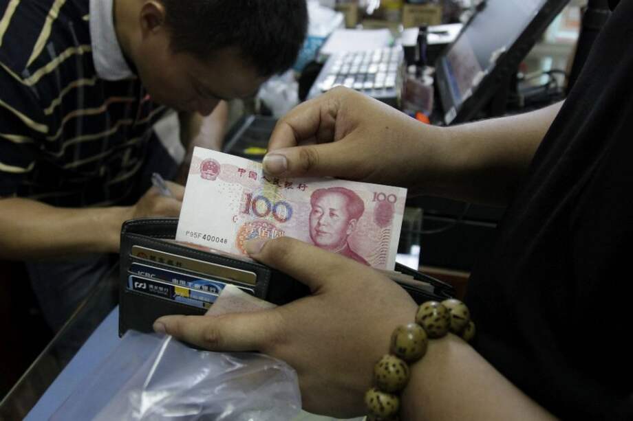 China devalúo su moneda y tiene en vilo al mundo. / EFE