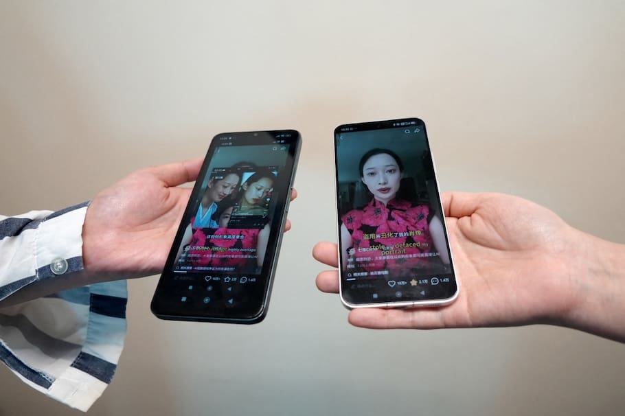 This photo illustration taken in Hong Kong on April 16, 2026 shows phones displaying screenshots of a video from Chinese model and influencer Christine Li accusing an AI microdrama of stealing her likeness without consent. Two people told AFP their likenesses were cast without consent in the AI-generated show "The Peach Blossom Hairpin", which ran on Hongguo, a major microdrama app owned by Tiktok parent company ByteDance.
Microdramas are ultra-short, online soap operas hugely popular in China and elsewhere.
Hongguo hosts thousands of free, bite-sized shows -- both live-action and AI-generated -- whose episodes are two or three minutes long. (Photo by Mahmoud RIZK / AFP) / To go with 'China-AI-Entertainment-Legal' focus by Sophia Xu and Purple Romero
