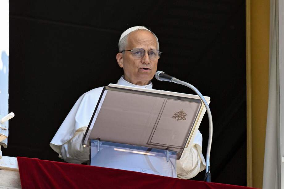 A handout picture provided by the Vatican Media shows Pope Leo XIV addressing the crowd from the window of the apostolic palace overlooking St. Peter's Square during the Angelus prayer in the Vatican, 29 June 2025.