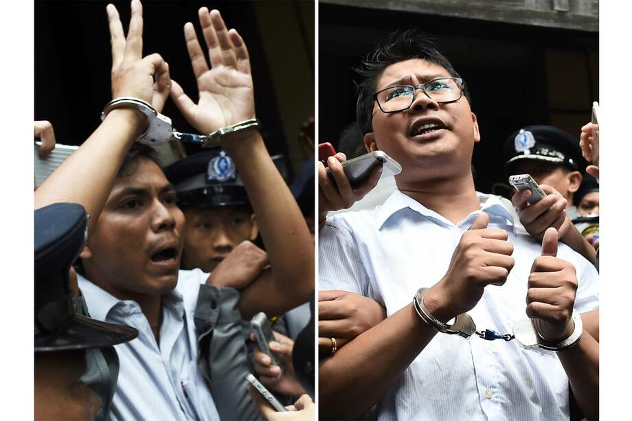 Los periodistas de la agencia Reuters Kyaw Soe Oo (izq.) y Wa Lone (der.). / AFP.