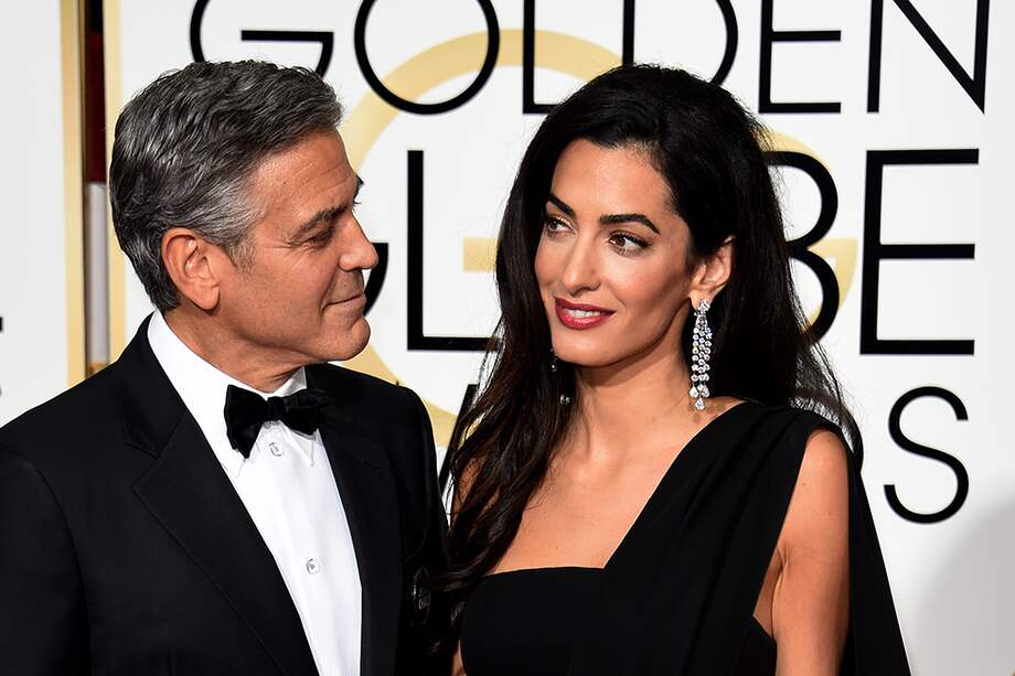George Clooney y su esposa Amal en 2015. / AFP