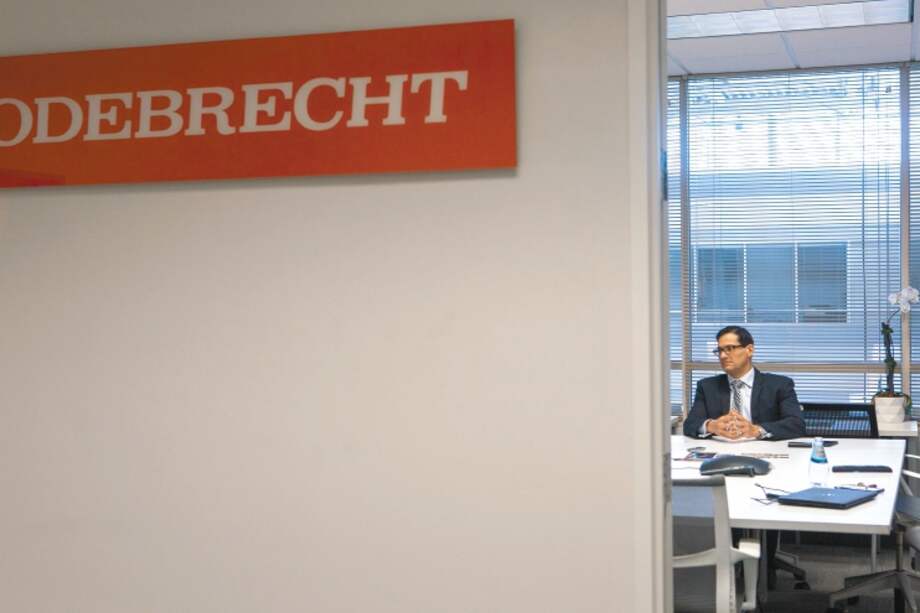 Signage is seen outside the office of Yuri Kertzman, president and chief executive officer of Odebrecht Construction Inc., right, during an interview in Miami, Florida, U.S, on Monday, Oct. 1, 2018. The U.S. Census Bureau is releasing construction spending figures on July 1. Photographer: Jayme Gershen/Bloomberg