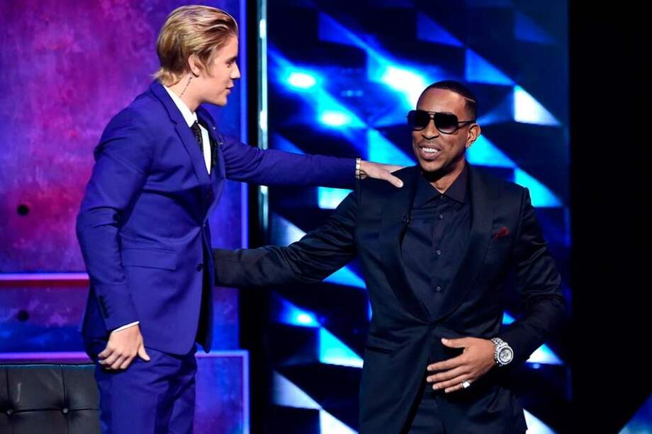Justin Bieber y Ludacris. / AFP