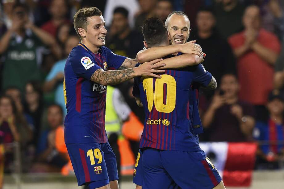Andrés Iniesta celebra el segundo gol del Barcelona frente al Málaga. / AFP