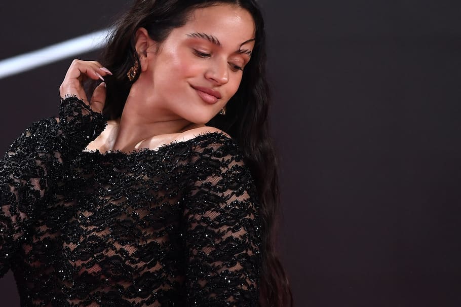 (FILES) Spanish singer Rosalia arrives at the 24th Annual Latin Grammy Awards ceremony at the Conference and Exhibition Centre (FIBES) in Sevilla on November 16, 2023. A fleeting appearance among the crowds in central Madrid, an ethereal presence in Barcelona, interviews, and exclusive listening parties in various countries... After weeks of high expectation, Rosalia released her fourth album, Lux, on November 7, 2025, in which the Spanish star explores feminine mysticism. (Photo by JORGE GUERRERO / AFP)
