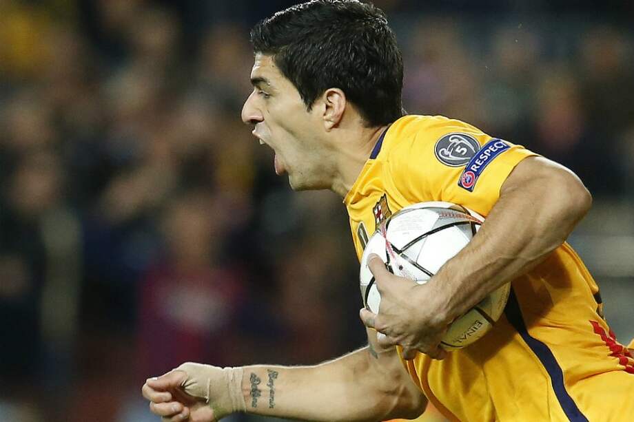 Suárez celebra el gol del descuento contra Atlético de Madrid. / AFP