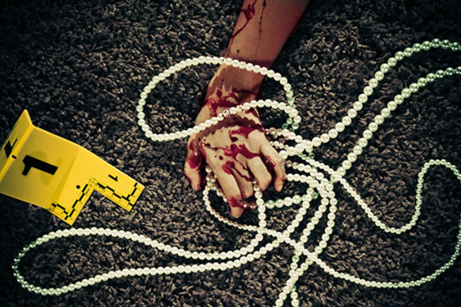 Hand of dead woman holding a pearl necklace --- Image by © Paul Taylor/Corbis
