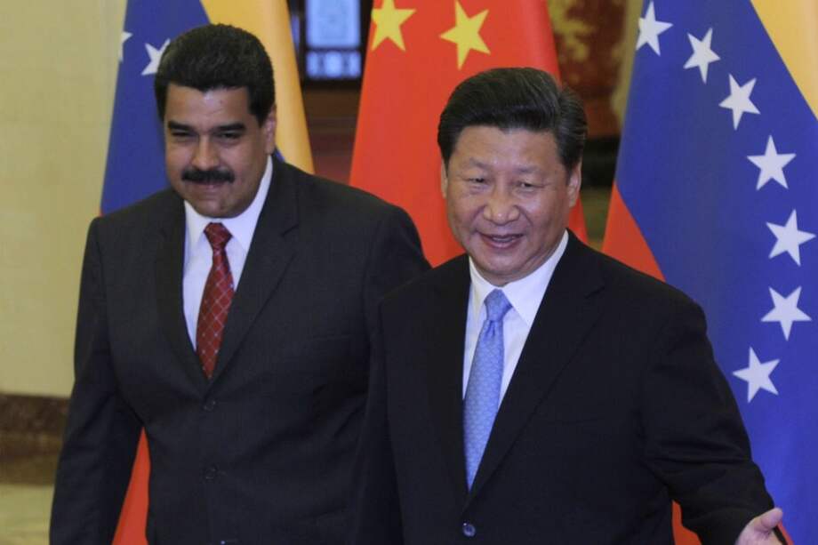 El presidente de Venezuela, Nicolás Maduro y el presidente de China, Xi Jinping. / Bloomberg News