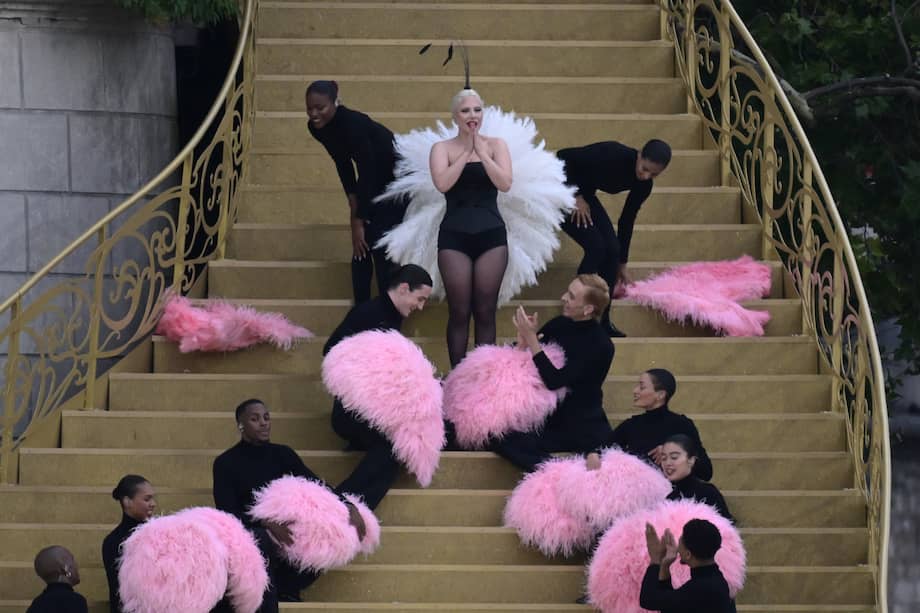 US' singer Lady Gaga sings at the Sully bridge area prior to the opening ceremony of the Paris 2024 Olympic Games in Paris on July 26, 2024. (Photo by Emmanuel DUNAND / AFP)