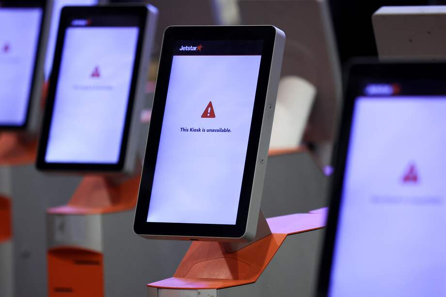 El sistema de check-in caído en el aeropuerto de Sídney, Australia. Photographer: Brendon Thorne/Bloomberg