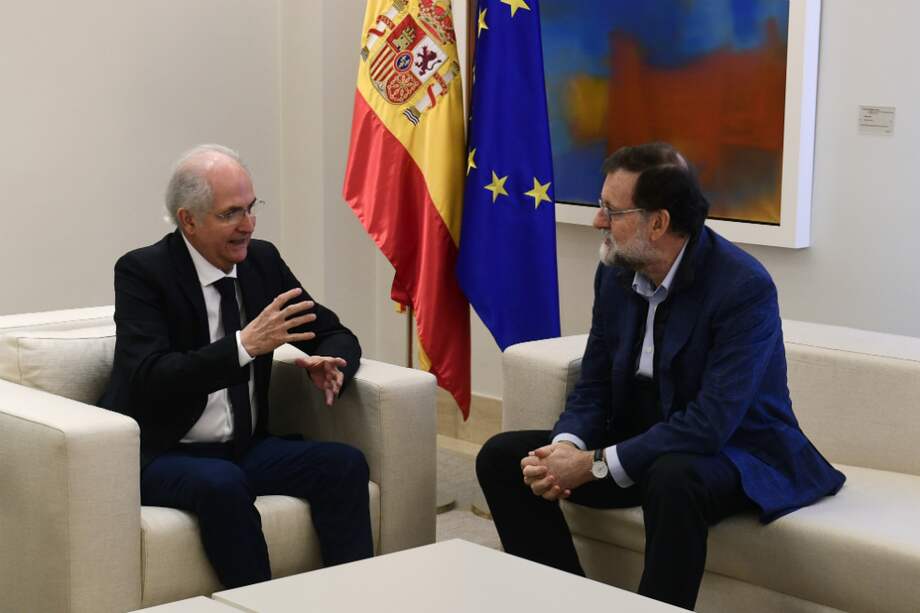 Antonio Ledezma y Mariano Rajoy. / AFP