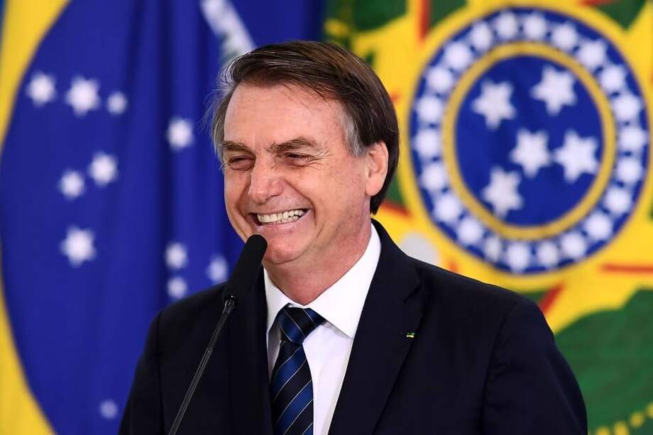 Cuando el presidente Jair Bolsonaro de Brasil se reunió con Trump en el Despacho Oval, su hijo Eduardo fue el único miembro de la delegación brasileña presente. / AFP