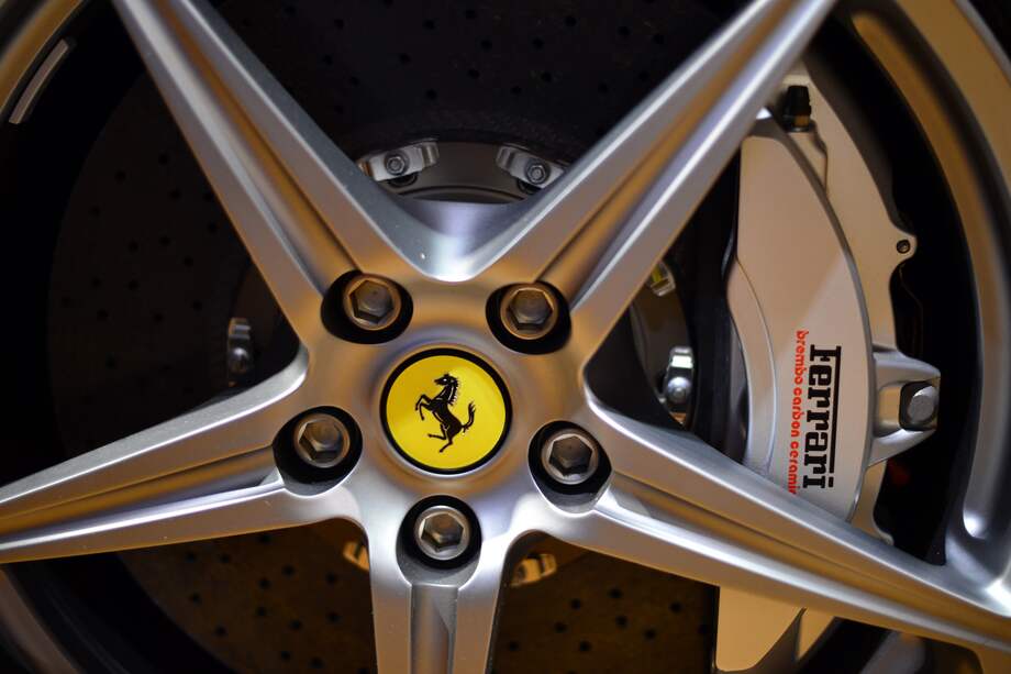 A wheel is displayed in the 'tailor-made' department of the Ferrari factory where the hand-finished road vehicles are being produced on December 5, 2012 in Maranello. The Ferrari 45 buildings's factory, where more than 3,000 workers produce the company�s GT and Formula 1 cars is based in Maranello. AFP PHOTO / GABRIEL BOUYS