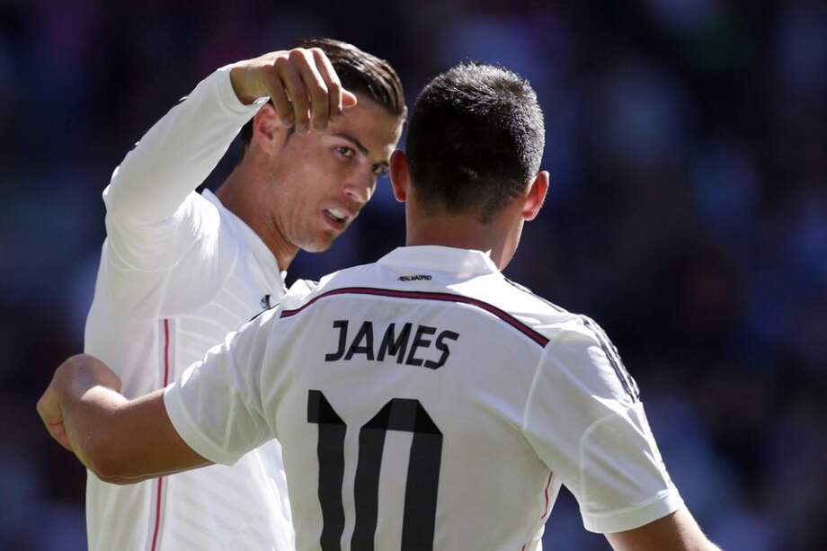 Cristiano Ronaldo celebra su primer tanto del partido con James Rodríguez. Foto: EFE