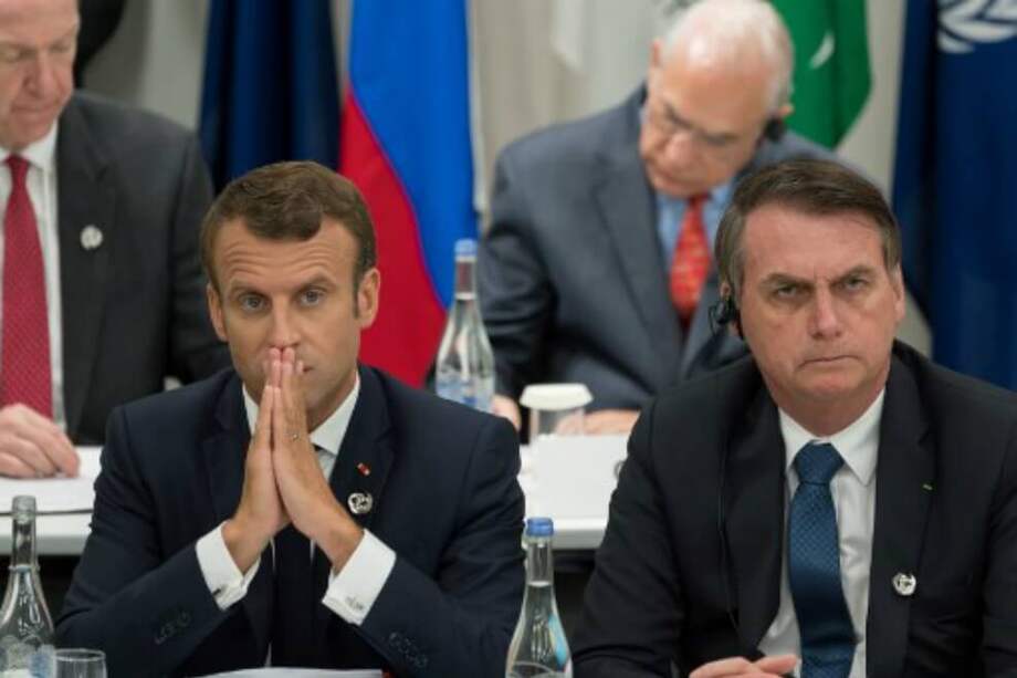 El presidente francés Emmanuel Macron considera que su homólogo brasileño Jair Bolsonaro "mintió" sobre sus compromisos en favor del medio ambiente, y anunció el viernes que, en estas condiciones, Francia se opone al acuerdo de libre comercio UE-Mercosur. / AFP