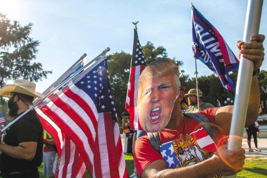 Simpatizantes apoyando al presidente Donald Trump / AFP / Apu GOMES