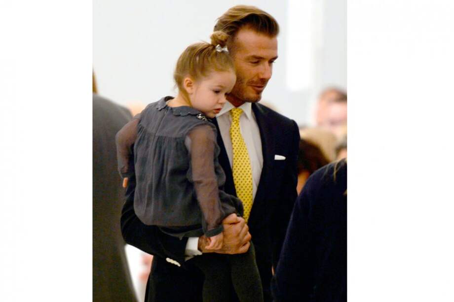 David Beckham y su hija Harper. / AFP