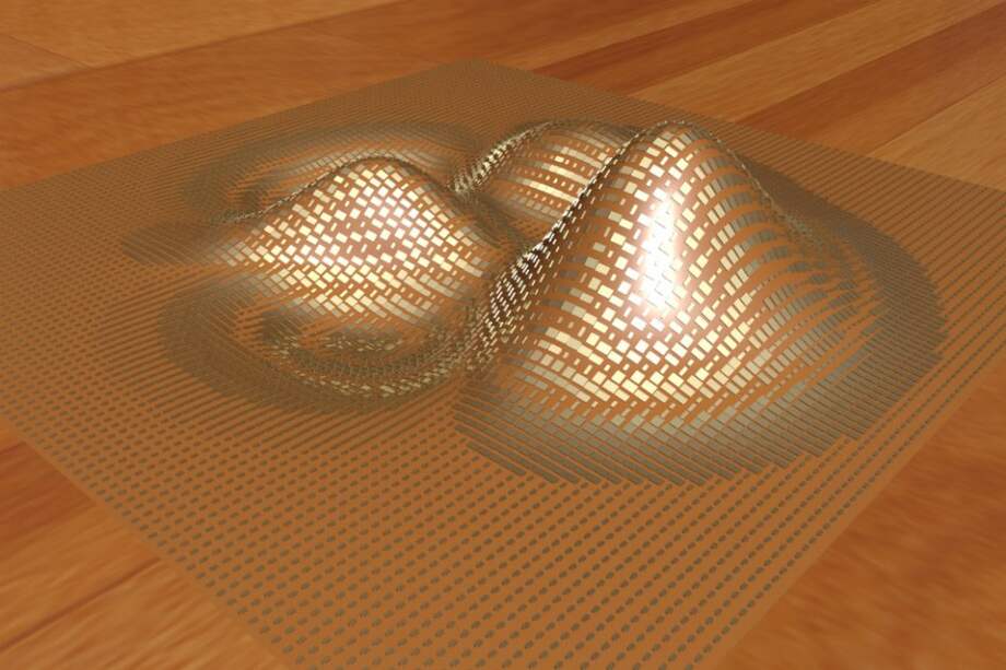 La imagen muestra como, utilizando elementos de oro, la capa vuelve indetectable el objeto. /AFP