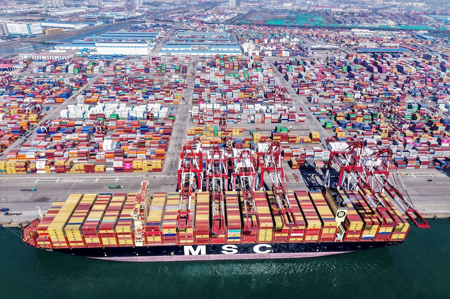 A container ship is seen at the port in Qingdao, in China's eastern Shandong province on April 15, 2025. China is expected to post first-quarter growth of around five percent on April 16, buoyed by exporters rushing to stave off higher US tariffs but still weighed by sluggish domestic consumption, analysts say. (Photo by AFP) / China OUT / CHINA OUT / CHINA OUT