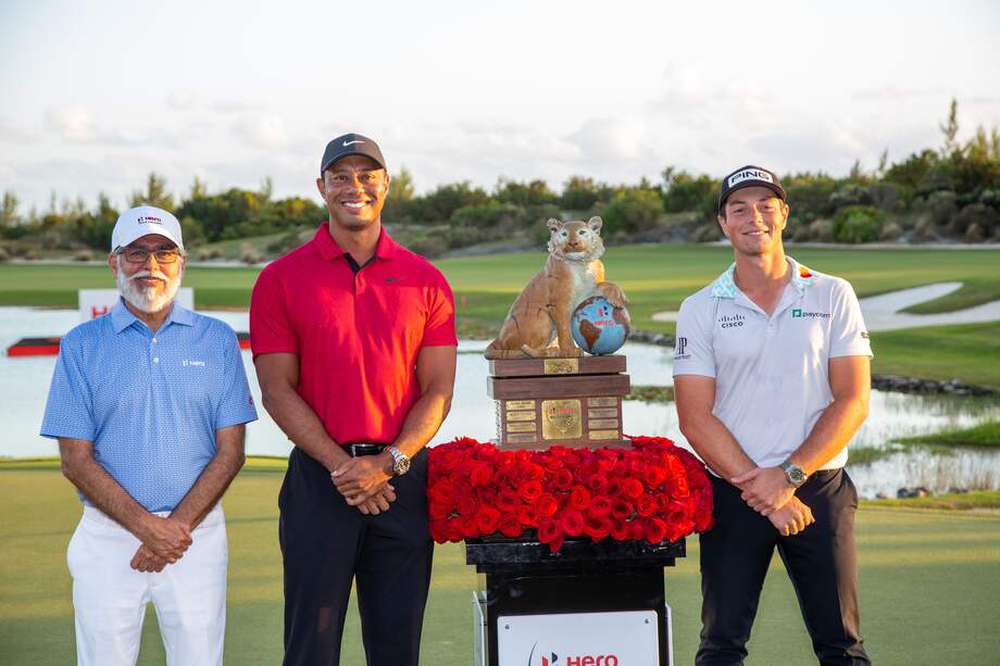Tiger Woods and Dr. Pawan Munjal, Chairman & CEO, Hero MotoCorp presenting the trophy to Viktor Hovland the 2022 winner of Hero World Challenge, at Albany Championship Course, Bahamas