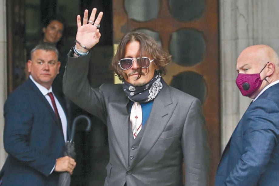 US actor Johnny Depp arrives on the second day of his libel trial against News Group Newspapers (NGN), at the High Court in London, on July 8, 2020. Depp is suing the publishers of The Sun and the author of the article for the claims that called him a "wife-beater" in April 2018. / AFP / ISABEL INFANTES