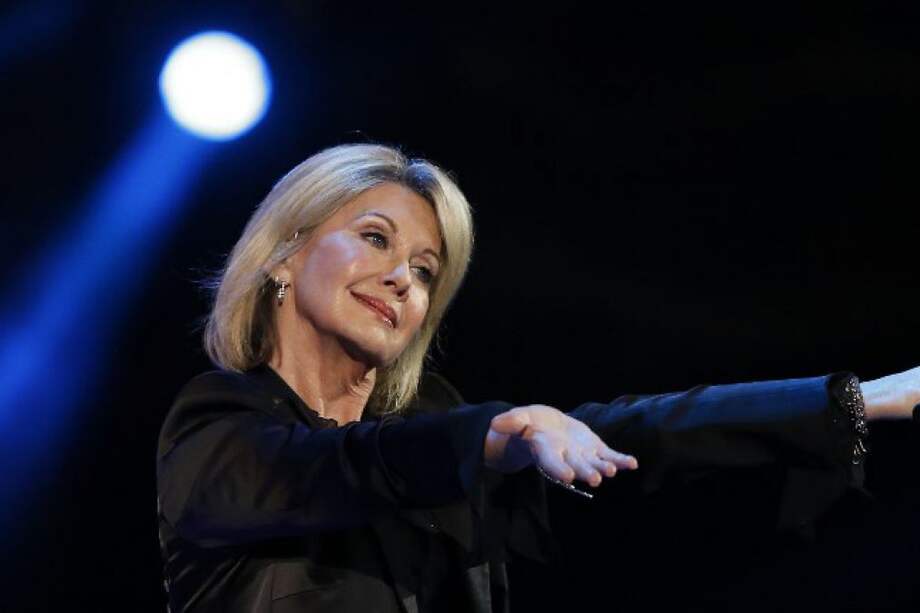 Olivia Newton-John, quien marcó una época con la película Grease, al lado de John Travolta. / Afp